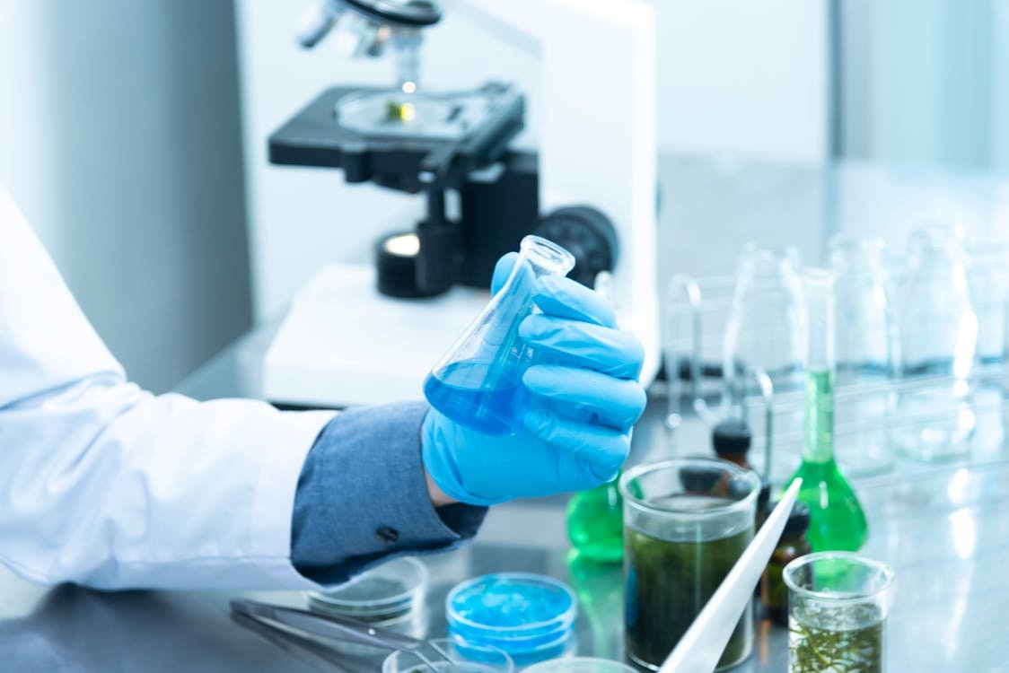 Free Person Holding Laboratory Flask Stock Photo